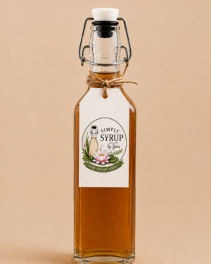 Brown Sugar Cinnamon Simple Syrup in a square glass swing-top bottle with Simply Syrup by Yuri label on a warm tan background.
